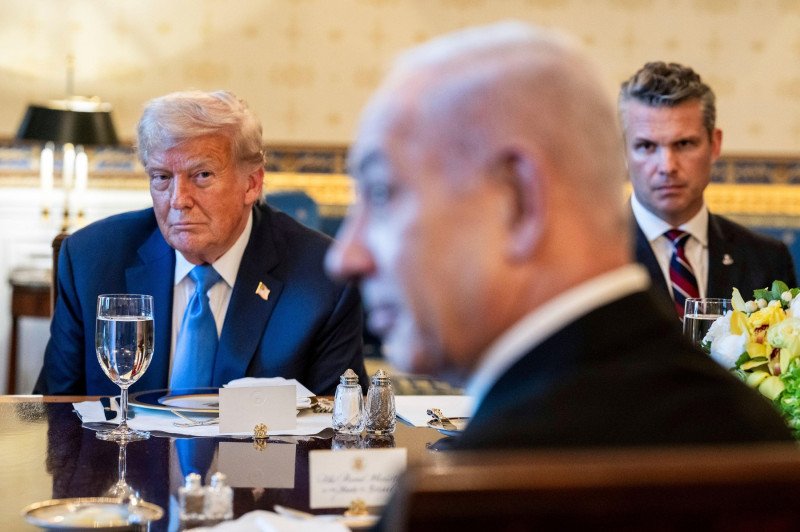 Washington, United States of America. 07 July, 2025. U.S. President Donald Trump, left, listens during a bilateral dinner for Israeli Prime Minister Benjamin Netanyahu, right, at the Blue Room of the White House, July 7, 2025, in Washington, D.C. Credit: